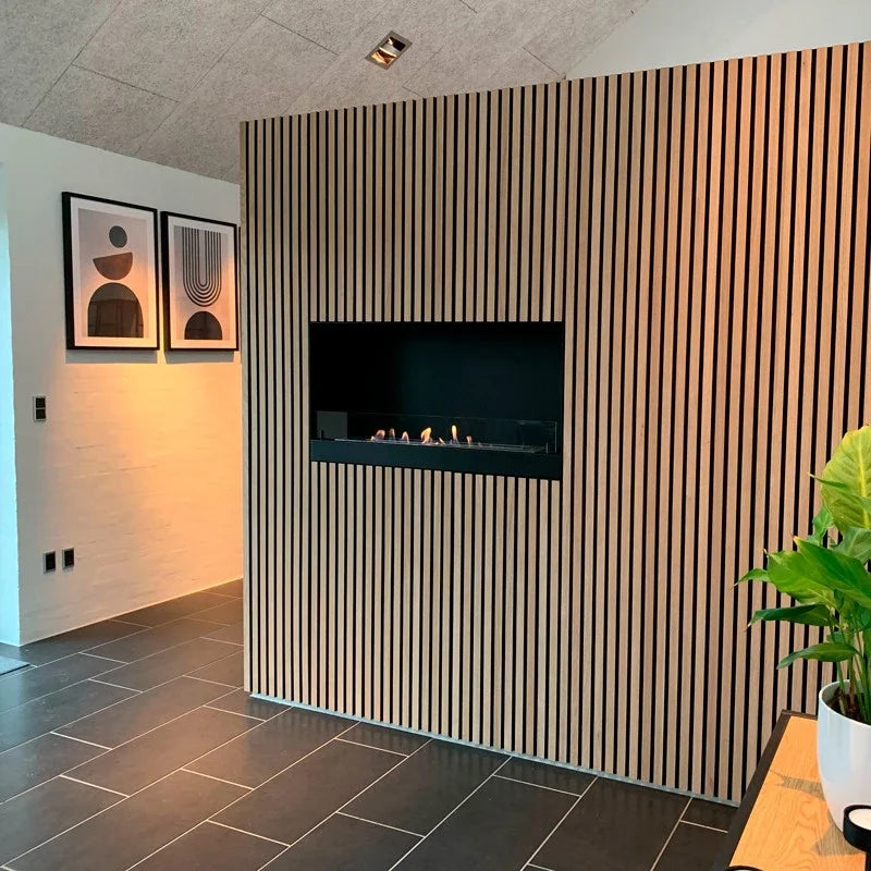 Built-in bioethanol fireplace installed in a slatted wood panel wall with lit flame