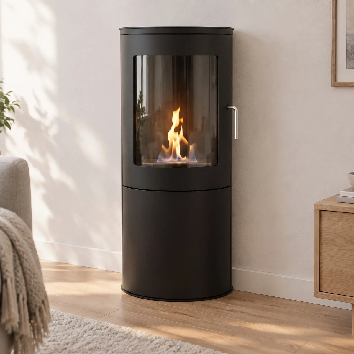 Richmond bioethanol fire stove with flat back, standing against a living room wall, lit flame, matte black finish