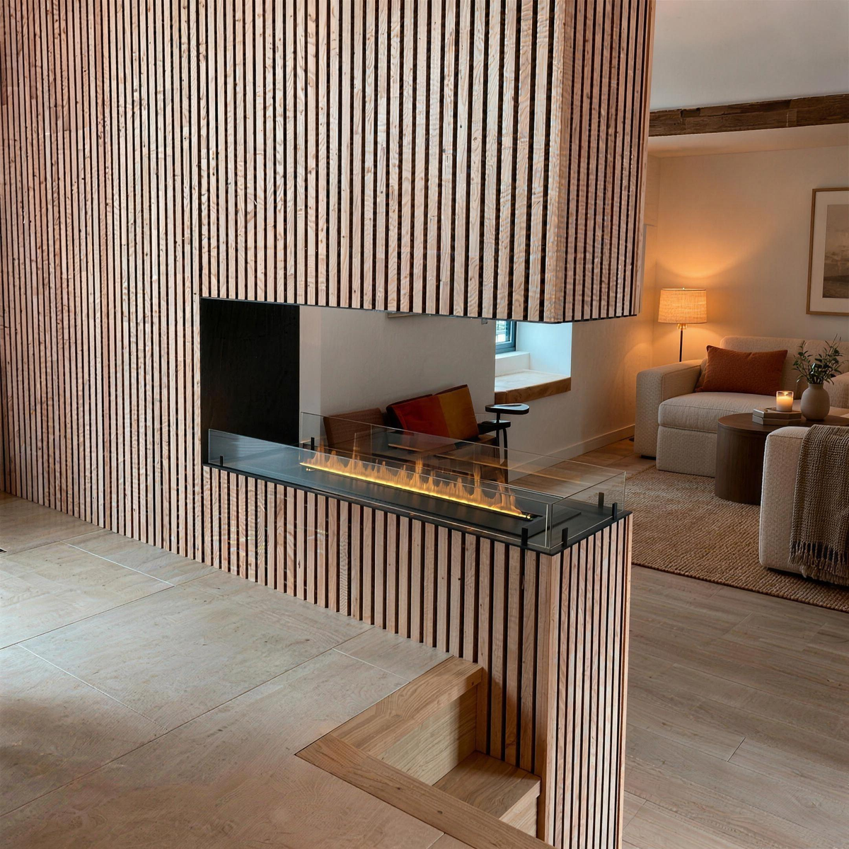 Foco Myst Room Divider 1200 water vapour fireplace built into a ribbed oak wood-slat wall beside a cozy seating nook